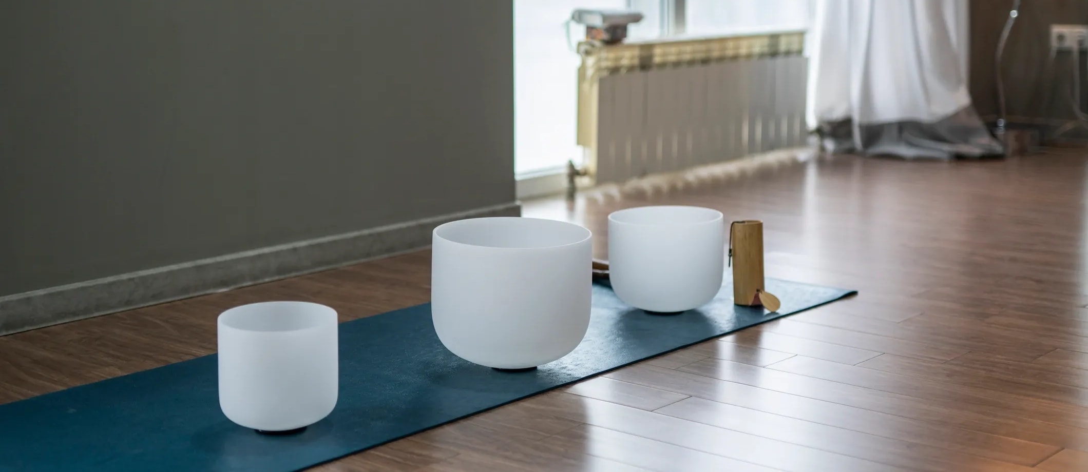 Crystal singing bowls arranged for a sound healing session